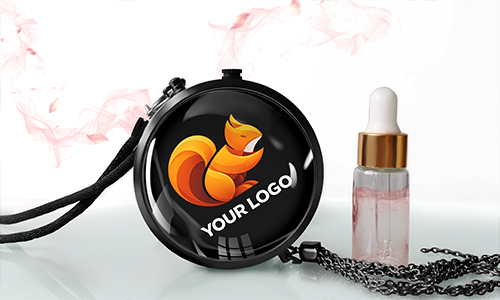 Round black compact case with orange-yellow fox logo YOUR LOGO, strap and chain, pink dropper bottle beside