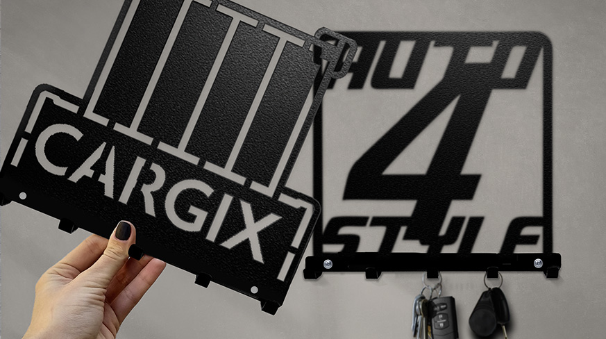 Custom metal wall key holders displaying personalized logo and name cutout designs