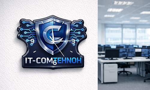 Office wall clock with IT-COMTEHNOH shield logo and circuit design, tech workstations visible in background