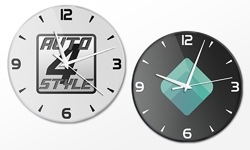 Two wall clocks side by side: left white AUTO 24 STYLE at 10:10, right black with green geometric logo at 9:15