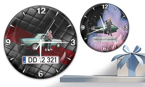 Two wall clocks with vintage cars and figures: left with turquoise car and quilted background, right with green car and fiery cosmic theme