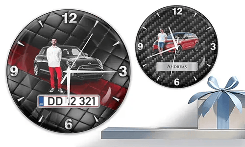 Two wall clocks with male figures and cars: left with black car on quilted background, right with red car and carbon texture