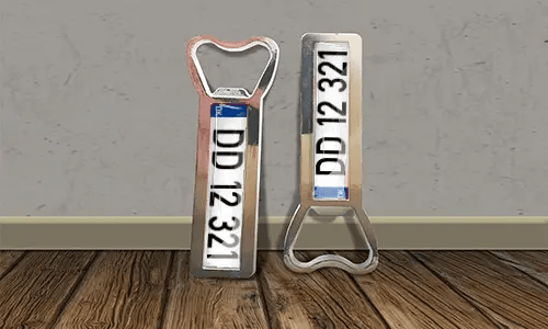 two bottle opener magnets on the floor