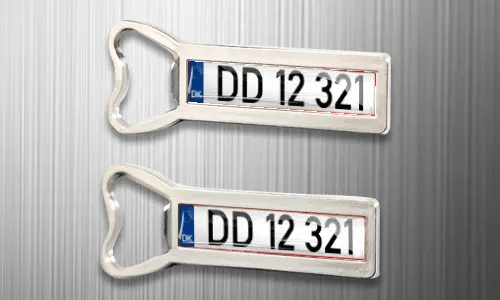 two magnet bottle openers on the fridge