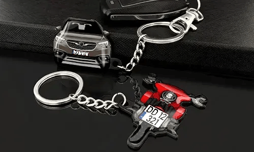 Avaimenperät auto- ja moottoripyörämuodossa, yksityiskohtaisilla ajoneuvokuvioilla