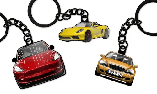 Personalized keychains displaying three different car models in red, yellow, and blue