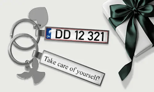 Metal license plate keychain with heart and angel wing charms