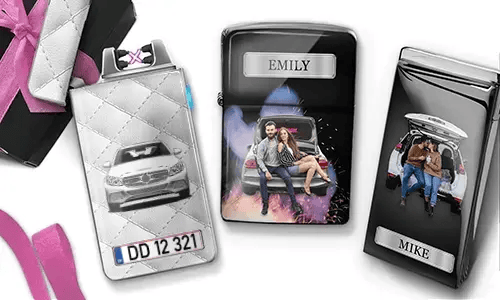 Three personalized cigarette cases are displayed. The first shows a car with a license plate. The second features a couple sitting on a car, labeled 