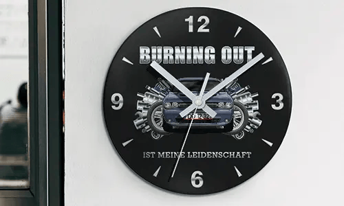 Wall clock with motorcycle and engine graphics, BURNING OUT IST MEINE LEIDENSCHAFT text on black face