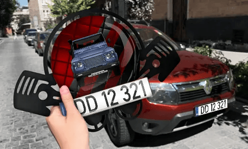 Autoschlüsselanhänger in der Hand mit dem Kennzeichen auto schlüsselanhänger gravur